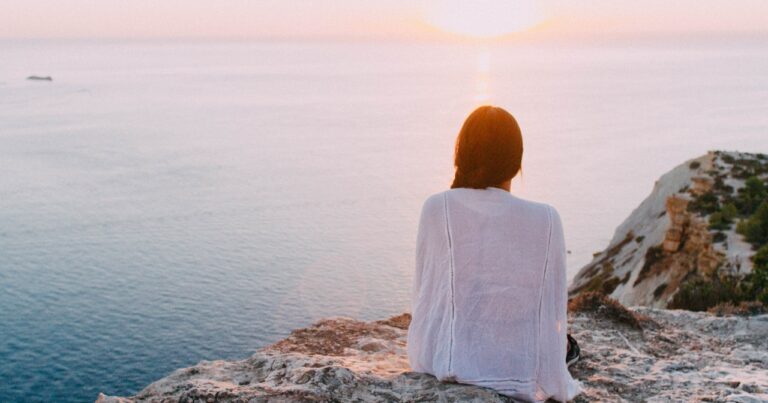 woman on a rock looking at the view