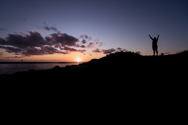 celebrating on a hill